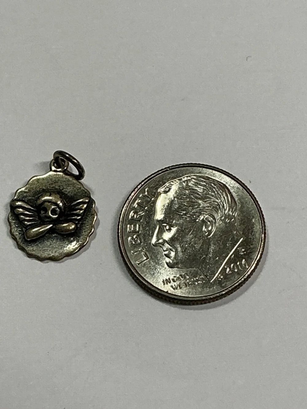 Vintage Sterling Silver JCM Guarding Angel Pendant. 1/2 inch diameter